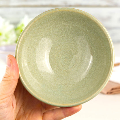 Pale Green handmade small bowl held in hand, showing rounded shape for dips, olives, sauces and little desserts