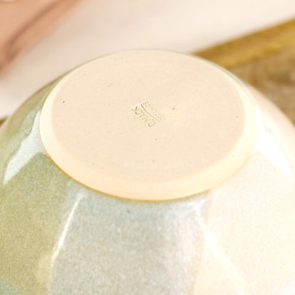 Base of Pale Green and White handmade small bowl showing maker’s mark and smooth burnished underside, designed to help reduce the risk of scratching 