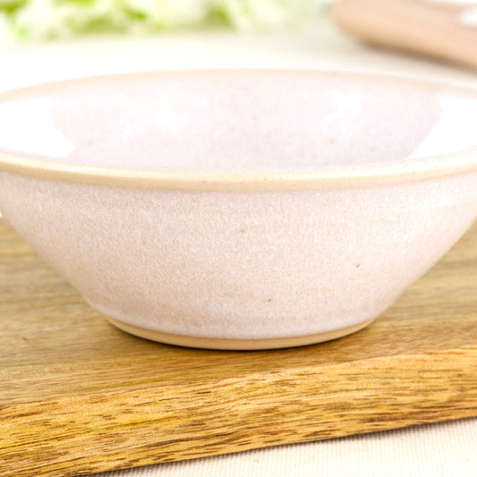Close-up of White Sea Smoothed Pebble glaze on a wheel-thrown small bowl with soft speckling and simple scandi style