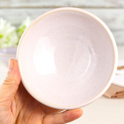 White handmade ceramic bowl held in hand, a small dip bowl for hummus, sauces, olives, nuts and little desserts