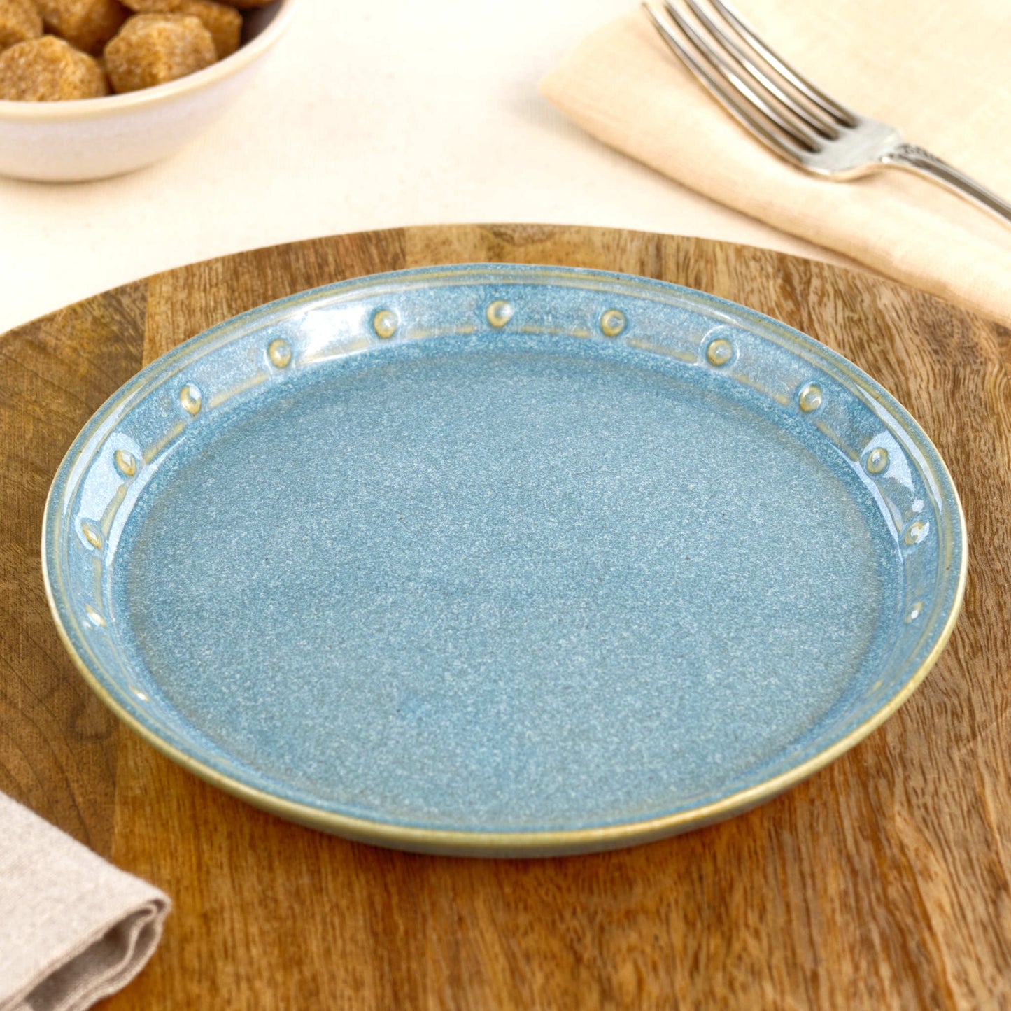 Coastal Blue small plate on a wooden board, a handmade ceramic side plate for cake, toast, bread, snacks or relaxed everyday tableware