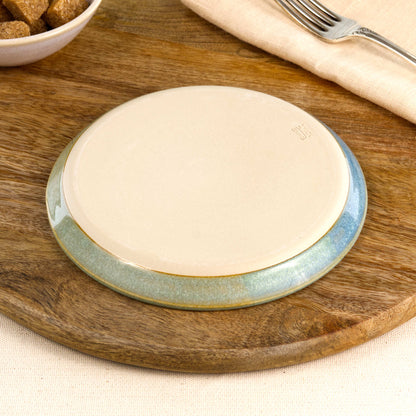 Base of a handmade Coastal Blue & Pale Green small plate, showing the smooth burnished foot and makers mark, wheel-thrown in my Sussex pottery studio