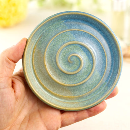 Coastal Blue and Pale Green soap holder shown in hand, wheel-thrown pottery soap tray with fresh sea glass tones
