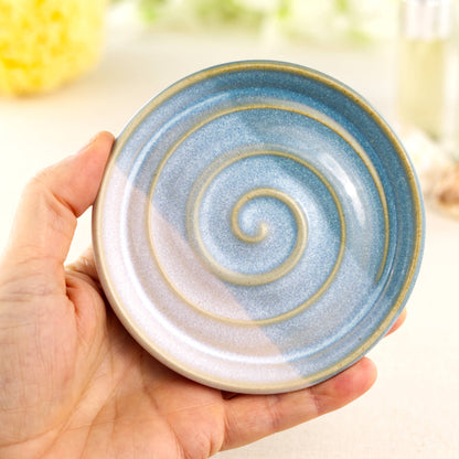 Coastal Blue and White pottery soap holder shown in hand, compact striped glaze soap tray with glossy speckled finish