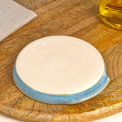 Base of handmade Coastal Blue spoon rest with makers mark, burnished smooth underside to help reduce scratches, Sussex studio pottery