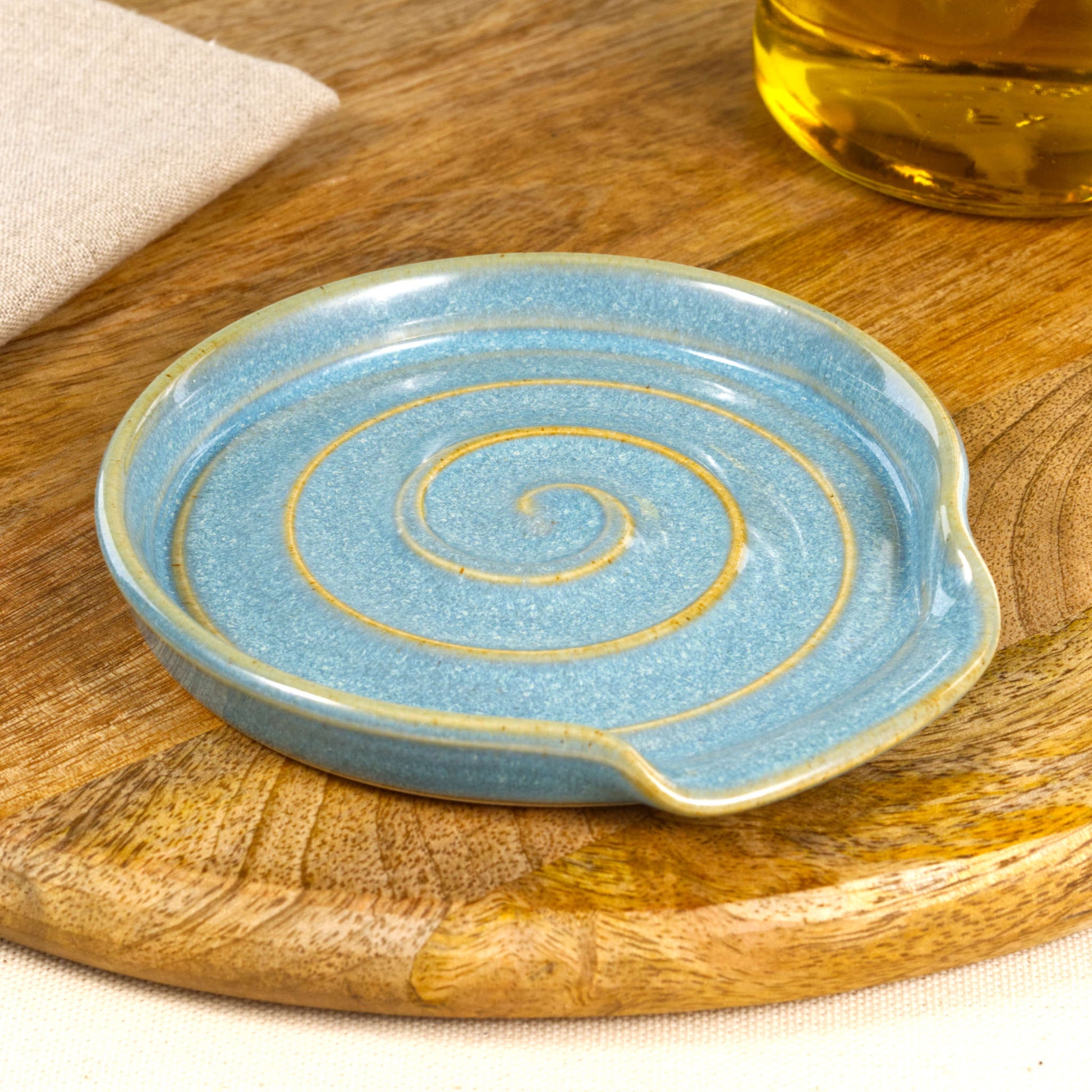 Handmade Coastal Blue ceramic spoon rest, wheel-thrown stoneware spoon holder with spiral design, artisan kitchenware gift from Sussex