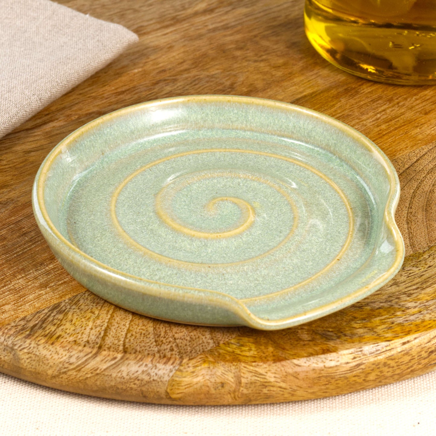 Handmade Pale Green ceramic spoon rest, wheel-thrown stoneware spoon holder with spiral design, artisan kitchenware gift from Sussex