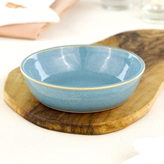 Wheel-thrown Coastal Blue tapas bowl on an olive wood board, handcrafted in a Sussex studio for antipasti, picky bits, BBQ nibbles and everyday serving