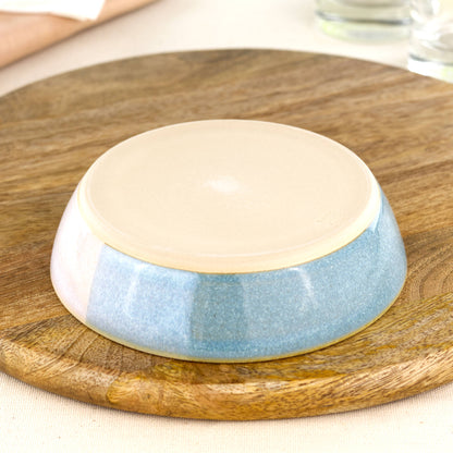 Base of a wheel-thrown tapas bowl in Coastal Blue & White, showing the smooth burnished foot and makers mark from a small Sussex pottery studio