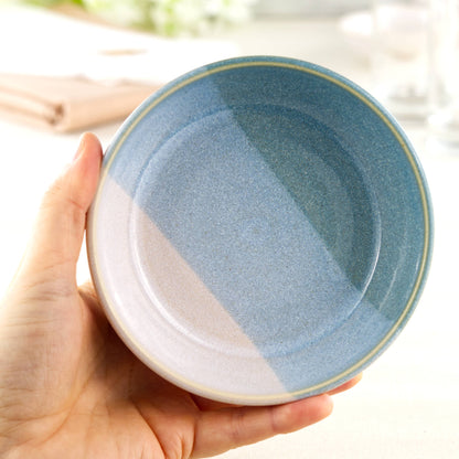 Handmade ceramic tapas bowl held in the hand, with Coastal Blue & White glazes and a flatter interior designed for small plates, dips and sharing food