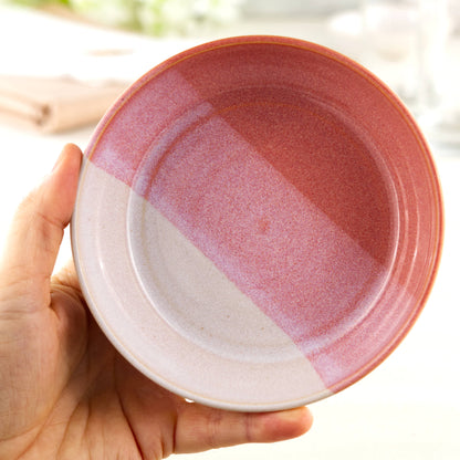 Handmade ceramic tapas bowl held in the hand, finished in Coral & White glazes with a flatter interior designed for mezze, small plates, side dishes and sharing food