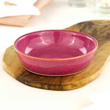 Wheel-thrown Crimson tapas bowl on an olive wood board, handcrafted in an artisan Sussex studio for antipasti, picky bits, side dishes and casual entertaining