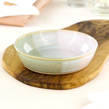 Wheel-thrown Pale Green & White tapas bowl on an olive wood board, a piece of British studio pottery for tapas-style serving, grazing platters and everyday artisan tableware