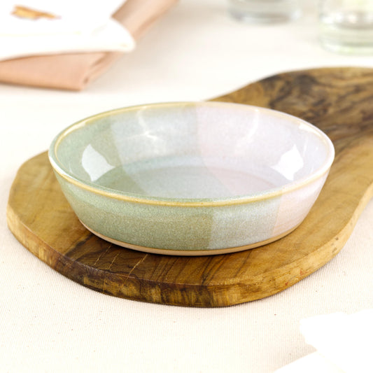 Wheel-thrown Pale Green & White tapas bowl on an olive wood board, a piece of British studio pottery for tapas-style serving, grazing platters and everyday artisan tableware