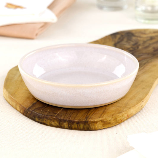 Wheel-thrown white tapas bowl on an olive wood board, handcrafted in a Sussex studio for small plates, picky bits, farmhouse kitchens and modern rustic tableware
